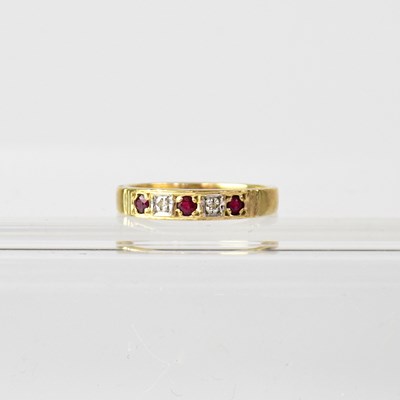 Lot 938 - A 9ct yellow gold five-stone dress ring, size...