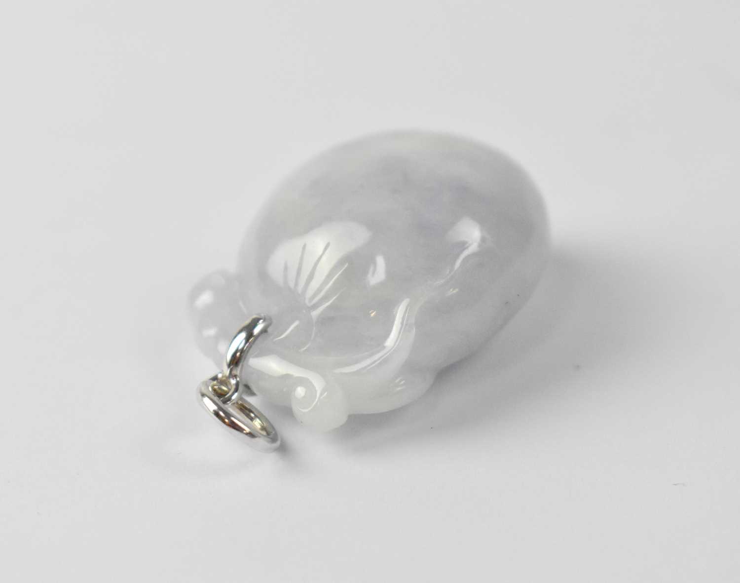 Lot 985 - A grey mauve heart-shaped jade pendant