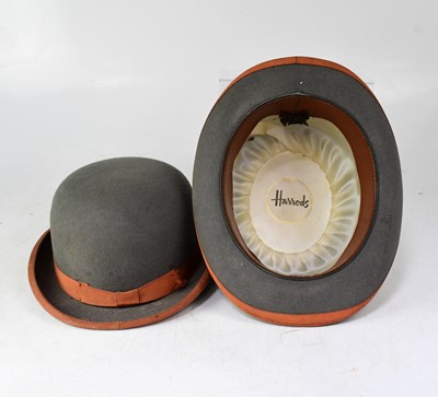 Lot 203 - A pair of Harrods grey felt bowler hats, the...