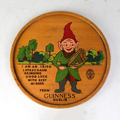 Lot 131 - GUINNESS; a mid-20th century circular tray...