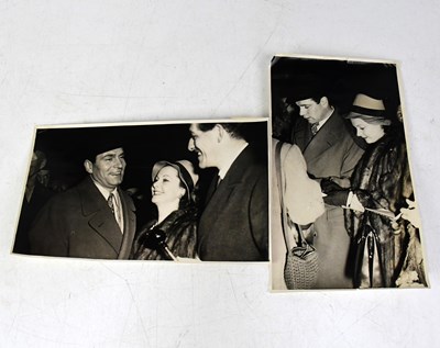 Lot 704 - Two black and white press photographs...