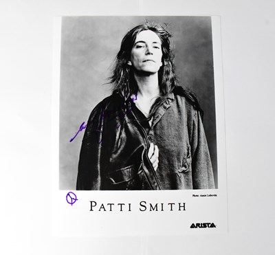 Lot 549 - PATTI SMITH; a black and white photograph...