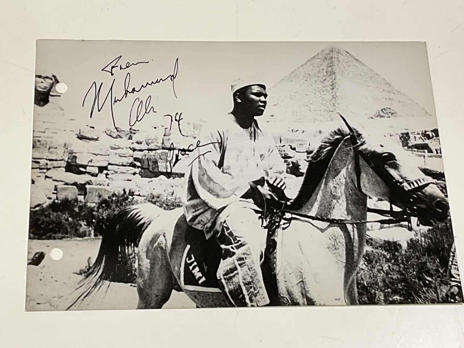Lot 2362 - Muhammad Ali; a black and white photograph of...