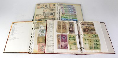 Lot 840 - Three albums of world banknotes, mainly...