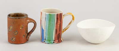 Lot 6 - IRENA SIBRIJNS; an earthenware mug covered in...