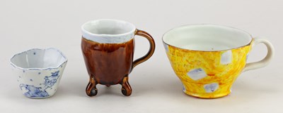 Lot 11 - JIRO TAKAISHI; a group of three porcelain cups...