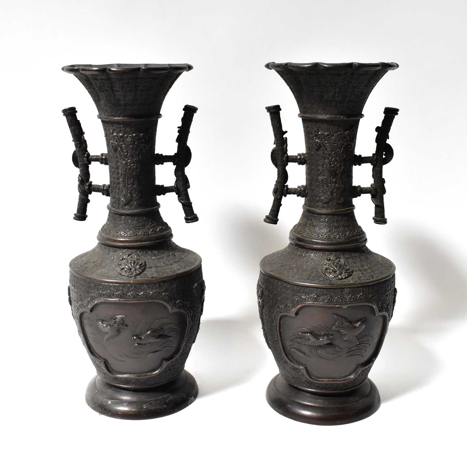 Lot 383 - A pair of Japanese Meiji period bronzed metal...