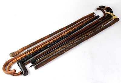 Lot 146 - A large collection of walking sticks and canes.