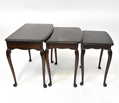 Lot 18 - A contemporary mahogany nest of three tables,...