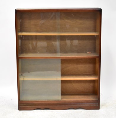 Lot 20 - A mid-20th century dark oak bookcase with tin...