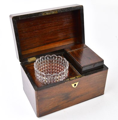 Lot 2076 - A mahogany tea caddy, enclosing a glass mixing...
