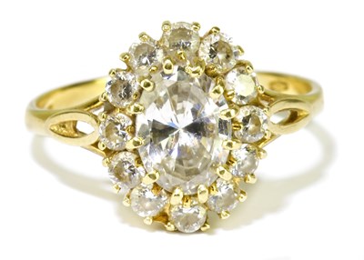 Lot 17 - An 18ct yellow gold oval diamond cluster ring,...