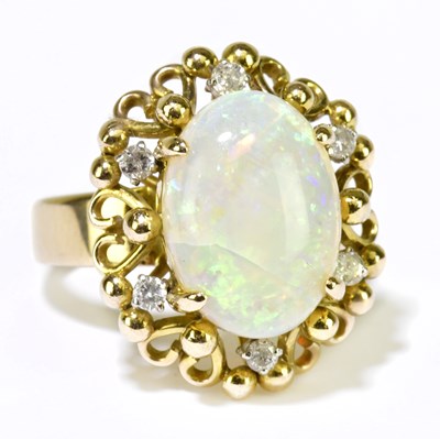 Lot 105 - A 14ct yellow gold opal and diamond cluster...