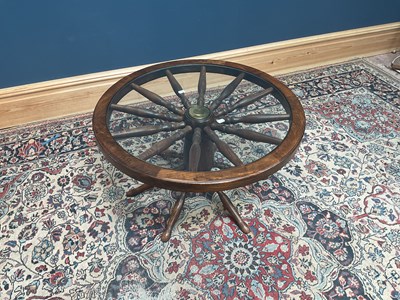 Lot 2573 - An elm wagon wheel type coffee table with...