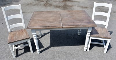 Lot 2566 - A modern shabby chic extending dining table...