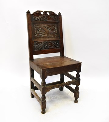 Lot 6 - An early 18th century oak back stool with...