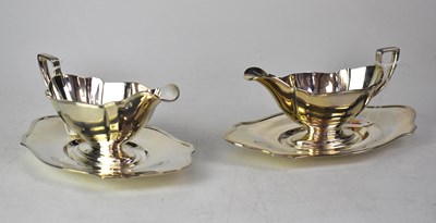 Lot 763 - GORHAM; a pair of Edwardian silver sauce boats...