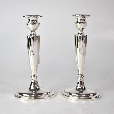 Lot 719 - GORHAM; a pair of American silver candlesticks...