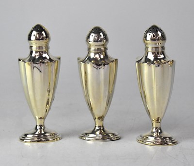 Lot 771 - GORHAM; three American silver pepperettes of...