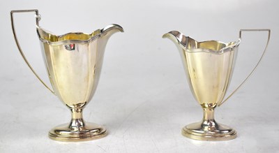 Lot 773 - GORHAM; two silver milk or cream jugs of...