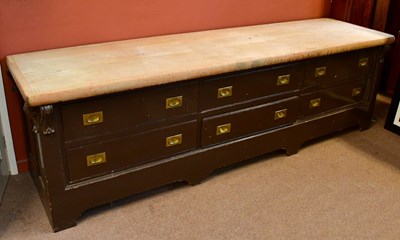 Lot 2512 - A large Victorian pine dresser base, the plank...