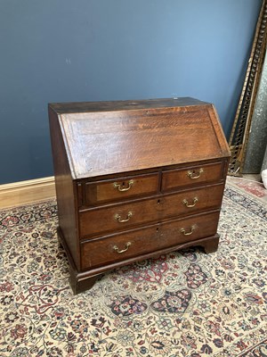 Lot 2525 - An 18th century oak bureau, the fall front...