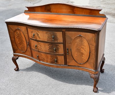Lot 2455 - An early 20th century mahogany serpentine...