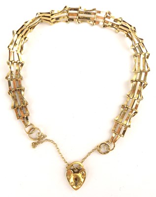 Lot 1046 - A 9ct gold four bar gate bracelet with 9ct...