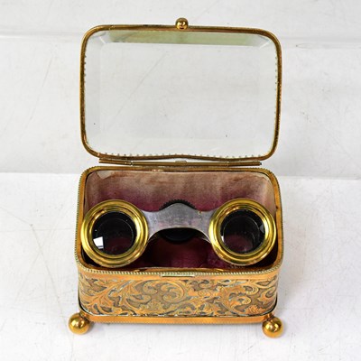 Lot 166 - A pair of opera glasses with snakeskin covers,...
