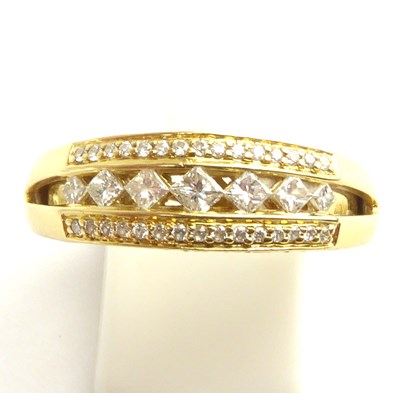 Lot 847 - An 18ct gold diamond half eternity ring...