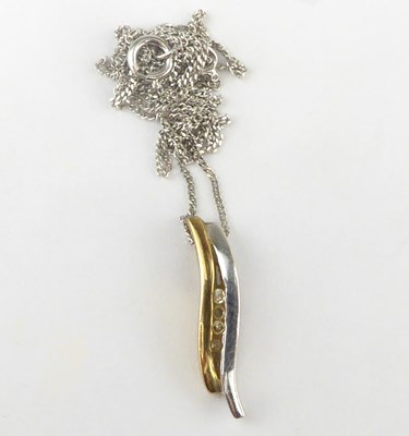 Lot 1112 - A 9ct gold double bar pendant with four tiny...