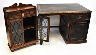 Lot 74 - An Edwardian oak student's desk with lift-up...