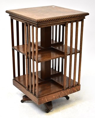 Lot 43 - An early 20th century oak revolving bookcase...