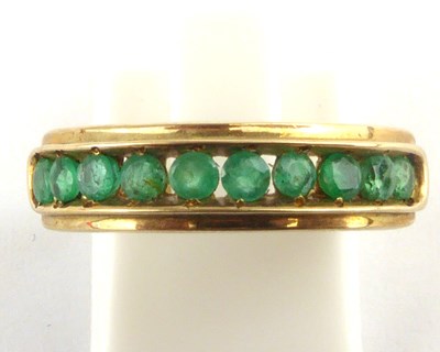 Lot 959 - A 9ct gold half eternity ring set with ten...
