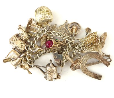 Lot 1058 - A vintage hallmarked silver charm bracelet...