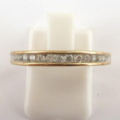 Lot 957 - A 9ct gold diamond half eternity ring, the...