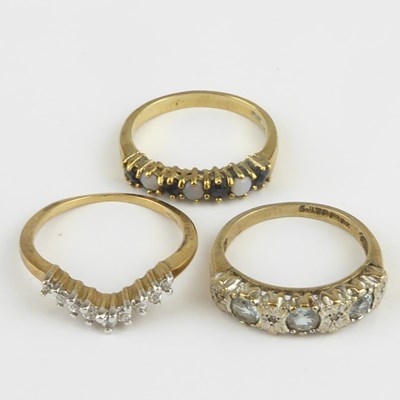 Lot 906 - Three 9ct gold dress rings comprising a white...
