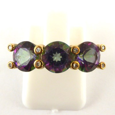 Lot 996 - A 9ct gold three-stone alexandrite ring, the...