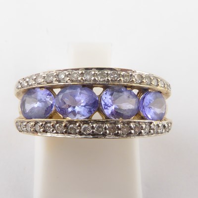 Lot 931 - A 9ct gold tanzanite and diamond ring, the...
