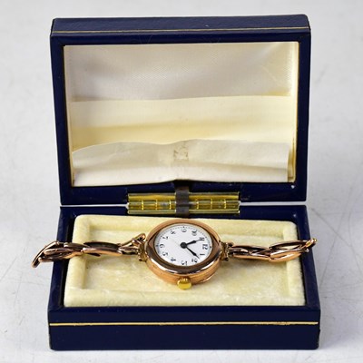 Lot 1327 - A 9ct gold wristwatch, the enamelled dial set...