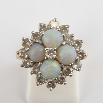 Lot 851 - An 18ct gold opal and diamond cluster ring,...