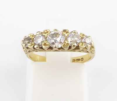 Lot 865 - An 18ct gold diamond ring with five claw set...