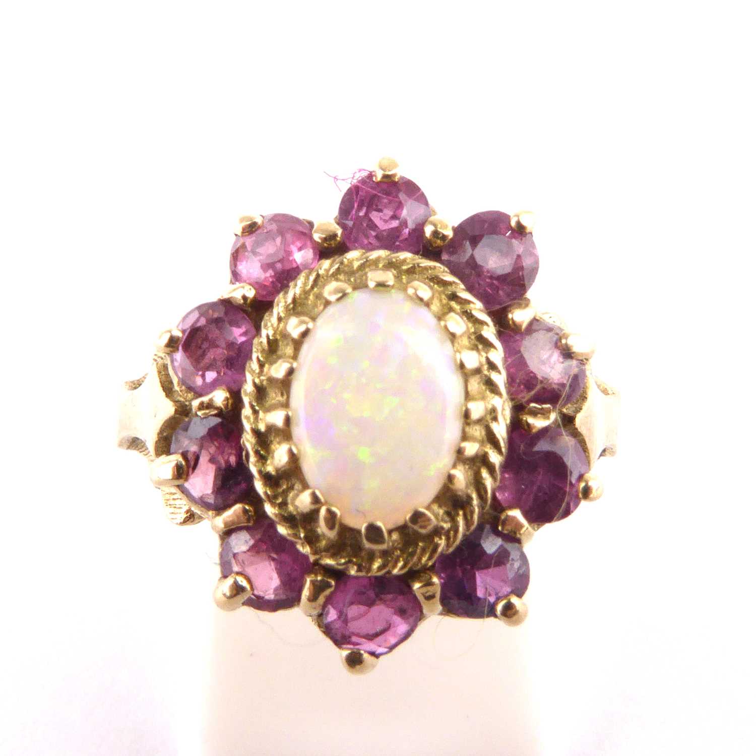 Lot 875 - An 9ct gold opal and pink topaz set cluster...
