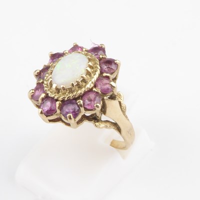 Lot 875 - An 9ct gold opal and pink topaz set cluster...