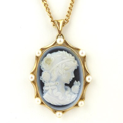 Lot 1123 - A carved blue paste cameo within a 9ct gold...