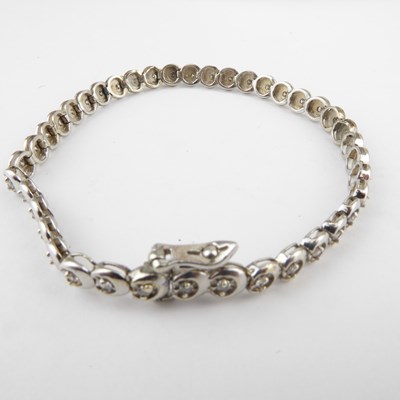 Lot 1023 - A 9ct gold diamond set tennis bracelet, with...