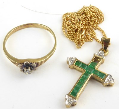 Lot 1223 - A gold diamond and emerald set cross pendant,...