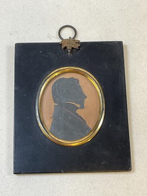 Lot 24 - A mid 19th century miniature portrait...