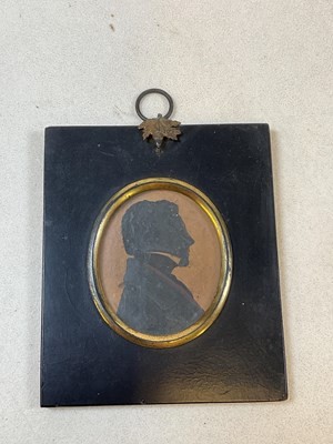 Lot 24 - A mid 19th century miniature portrait...