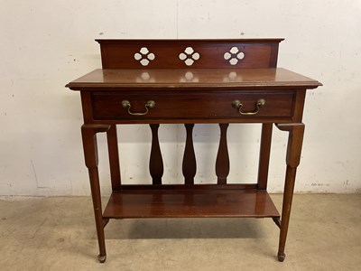 Lot 590 - An Edwardian mahogany two tiered side table...
